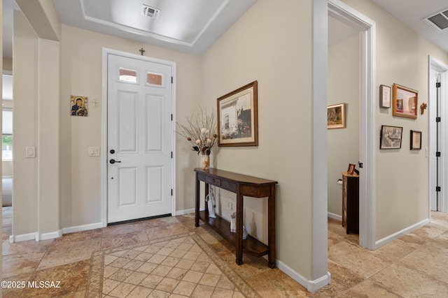 59962 E Arroyo Grande Dr, Oracle, AZ 85623 - foyer with baseboards, a raised ceiling, and light stone finish floors