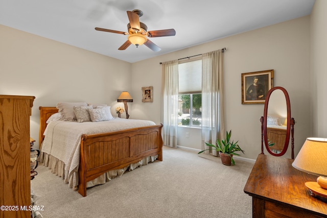 59962 E Arroyo Grande Dr, Oracle, AZ 85623 - bedroom featuring light colored carpet, ceiling fan, and baseboards