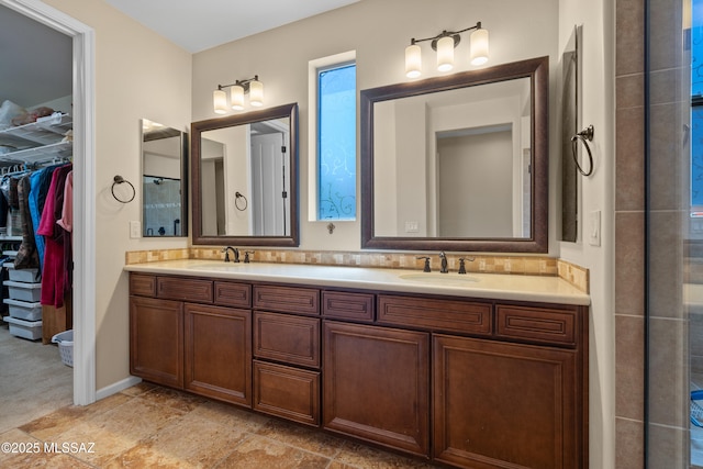 59962 E Arroyo Grande Dr, Oracle, AZ 85623 - full bathroom featuring a spacious closet, double vanity, and a tile shower