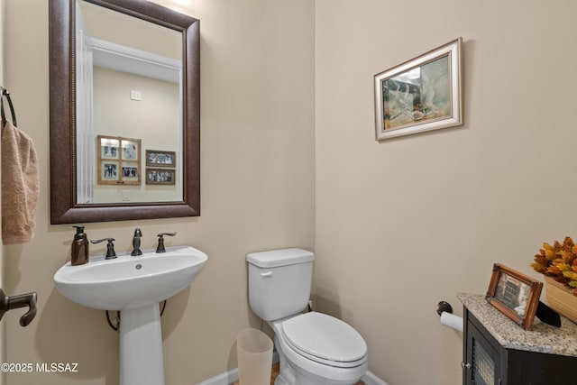 59962 E Arroyo Grande Dr, Oracle, AZ 85623 - half bathroom with baseboards and toilet