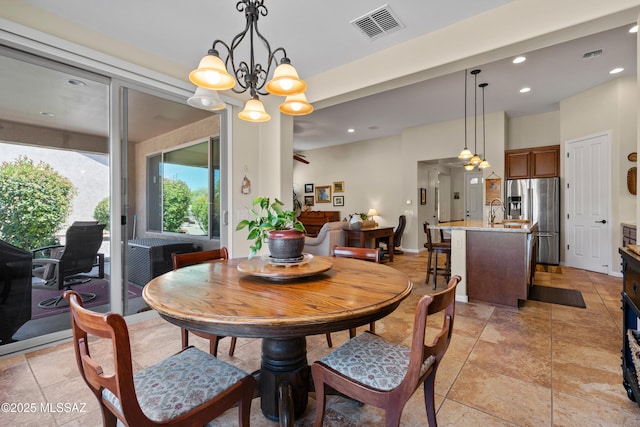 59962 E Arroyo Grande Dr, Oracle, AZ 85623 - dining room with recessed lighting and a chandelier