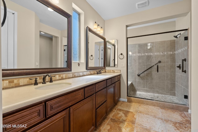 59962 E Arroyo Grande Dr, Oracle, AZ 85623 - bathroom with a shower stall, baseboards, and double vanity