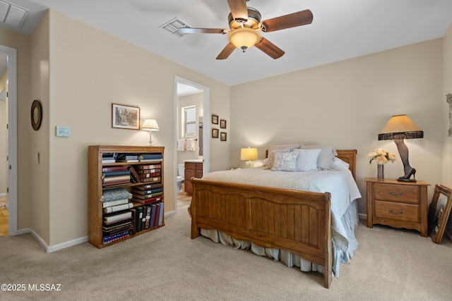 59962 E Arroyo Grande Dr, Oracle, AZ 85623 - carpeted bedroom with ensuite bath, a ceiling fan, and baseboards