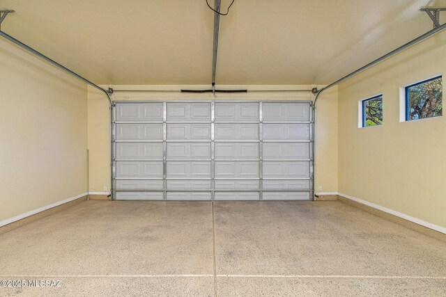 1050 E Easy St, Tucson, AZ 85719 - garage featuring baseboards