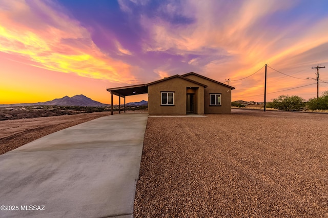 174 Via Casa, Rio Rico, AZ 85648 - single story home featuring driveway, a carport, stucco siding, and a mountain view