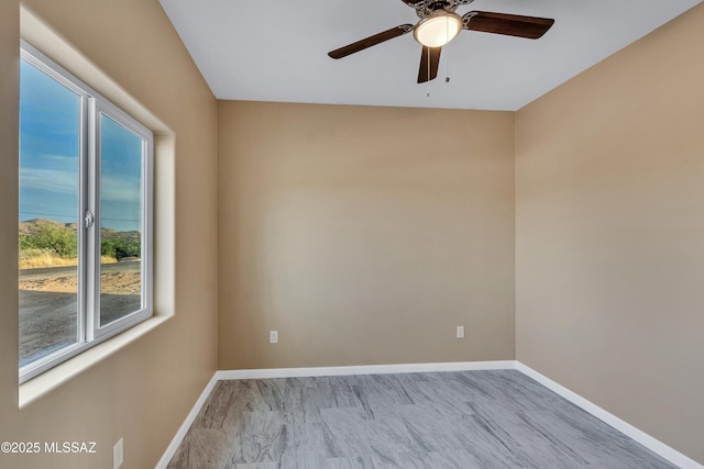 174 Via Casa, Rio Rico, AZ 85648 - spare room featuring a ceiling fan and baseboards