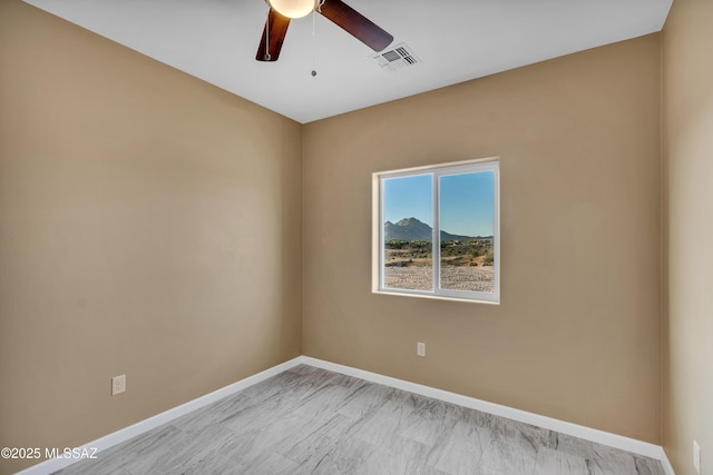 174 Via Casa, Rio Rico, AZ 85648 - unfurnished room featuring a ceiling fan and baseboards