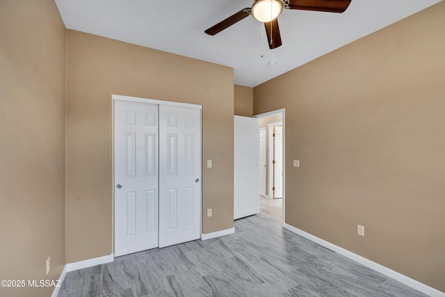 174 Via Casa, Rio Rico, AZ 85648 - unfurnished bedroom featuring a closet, baseboards, and a ceiling fan
