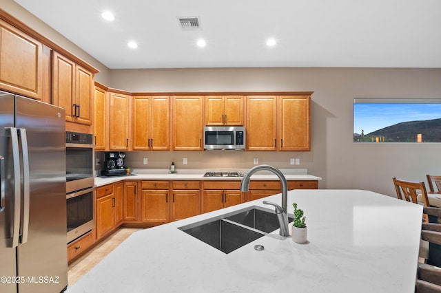 8183 N Sombrero Point Dr, Tucson, AZ 85743 - kitchen featuring stainless steel appliances, recessed lighting, light tile patterned floors, and a breakfast bar area