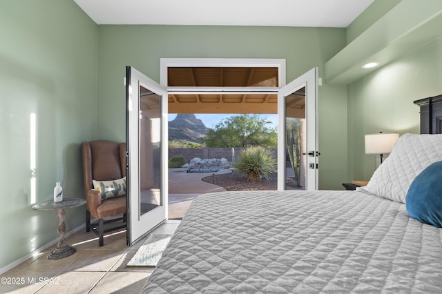 8183 N Sombrero Point Dr, Tucson, AZ 85743 - tiled bedroom featuring access to outside and french doors
