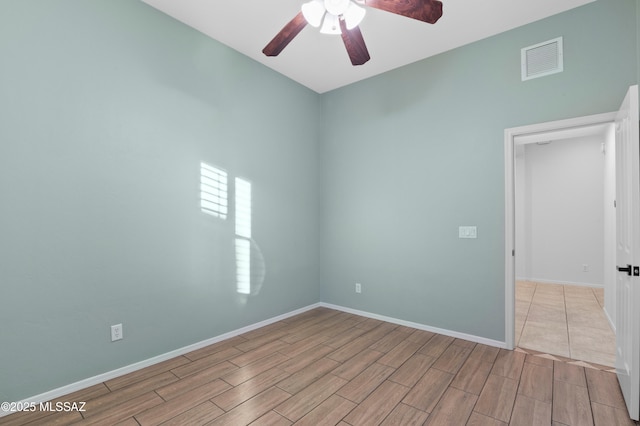 8183 N Sombrero Point Dr, Tucson, AZ 85743 - empty room with ceiling fan and wood finish floors