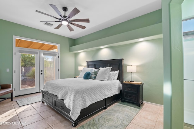 8183 N Sombrero Point Dr, Tucson, AZ 85743 - bedroom with access to outside, light tile patterned floors, and ceiling fan