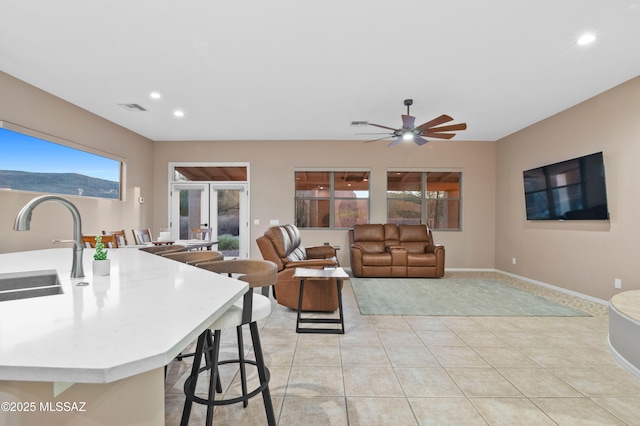 8183 N Sombrero Point Dr, Tucson, AZ 85743 - living area featuring recessed lighting, light tile patterned flooring, and a ceiling fan