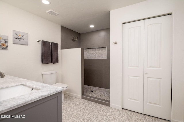 3409 E Linden St, Tucson, AZ 85716 - full bathroom with walk in shower, toilet, vanity, a closet, and recessed lighting
