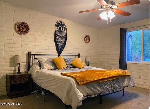 628 Corpino De Pecho, Green Valley, AZ 85614 - bedroom featuring carpet floors, brick wall, and ceiling fan
