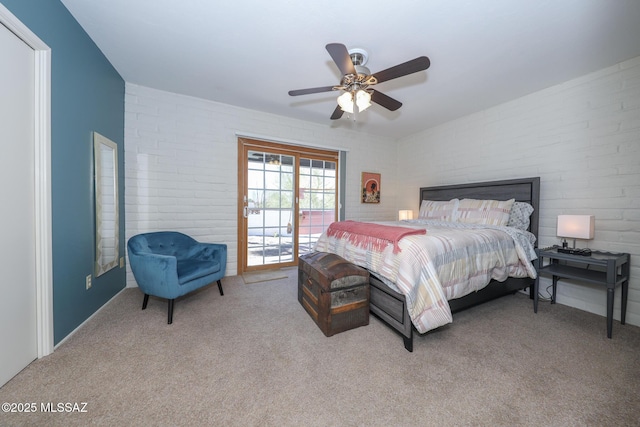 628 Corpino De Pecho, Green Valley, AZ 85614 - bedroom featuring access to outside, carpet floors, a ceiling fan, and brick wall