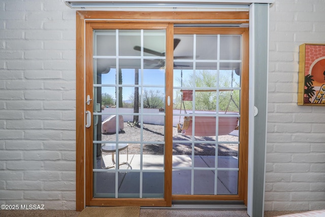 628 Corpino De Pecho, Green Valley, AZ 85614 - doorway to outside featuring brick wall and french doors