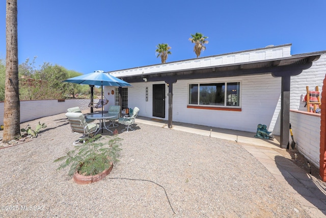 628 Corpino De Pecho, Green Valley, AZ 85614 - back of property with a patio area and concrete block siding