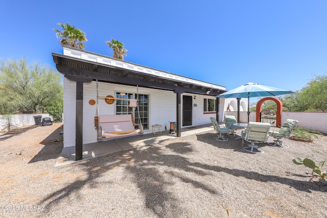 628 Corpino De Pecho, Green Valley, AZ 85614 - rear view of house featuring a patio area and outdoor dining space