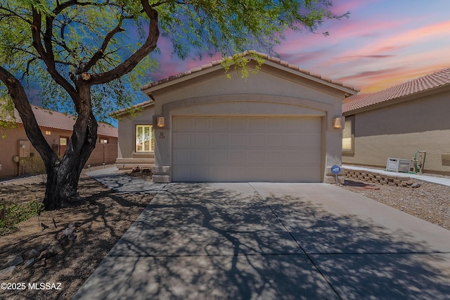 5590 W Acacia Blossom Pl, Marana, AZ 85658 - ranch-style home with concrete driveway, stucco siding, a garage, and a tiled roof