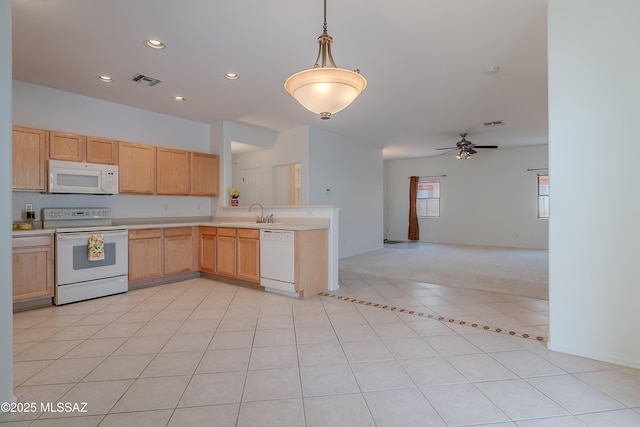 5590 W Acacia Blossom Pl, Marana, AZ 85658 - kitchen with white appliances, open floor plan, light countertops, a peninsula, and light brown cabinetry