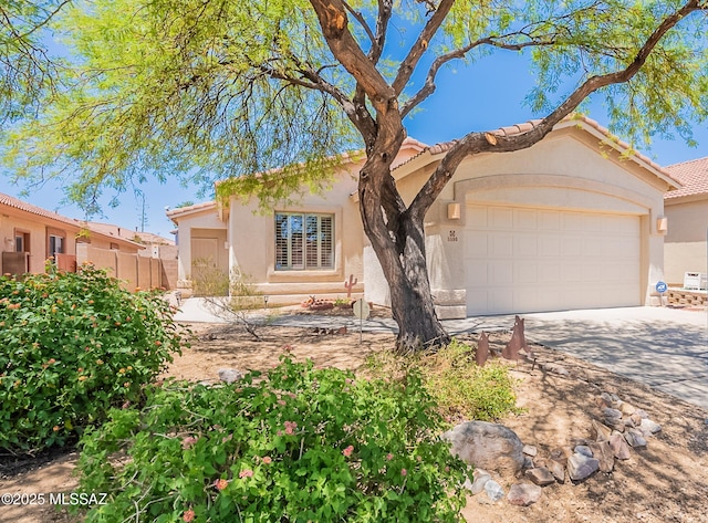 5590 W Acacia Blossom Pl, Marana, AZ 85658 - view of front of house with an attached garage, driveway, stucco siding, and a tile roof