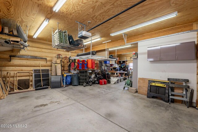 12709 N Casa Grande Ave, Mount Lemmon, AZ 85619 - garage with a workshop area and a garage door opener