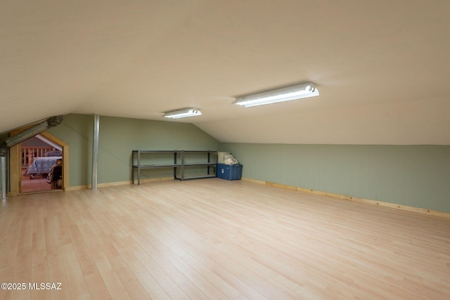 12709 N Casa Grande Ave, Mount Lemmon, AZ 85619 - additional living space with wood finished floors, lofted ceiling, and baseboards
