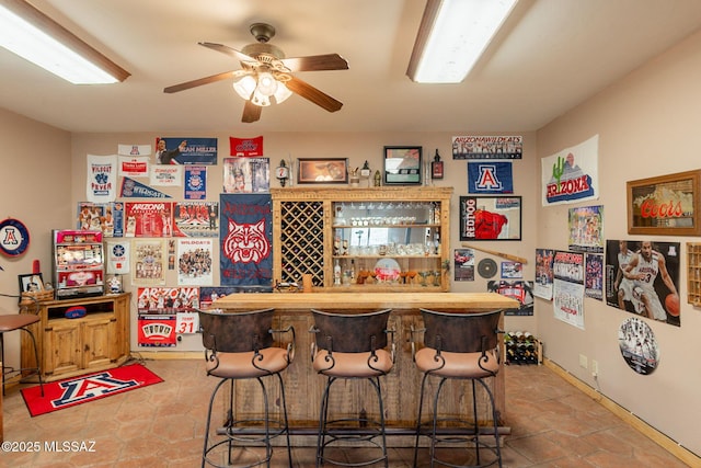 12709 N Casa Grande Ave, Mount Lemmon, AZ 85619 - indoor dry bar with a ceiling fan, tile patterned flooring, and baseboards