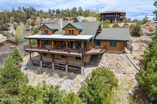 12709 N Casa Grande Ave, Mount Lemmon, AZ 85619 - rear view of house with log exterior and a chimney