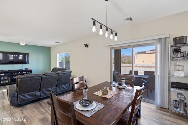 6494 E Brushback Loop, Tucson, AZ 85756 - dining area featuring light wood-style flooring and a ceiling fan