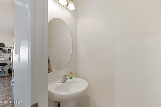 6494 E Brushback Loop, Tucson, AZ 85756 - bathroom with a sink and wood finished floors