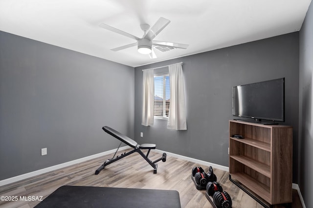 6494 E Brushback Loop, Tucson, AZ 85756 - workout area featuring a ceiling fan, wood finished floors, and baseboards