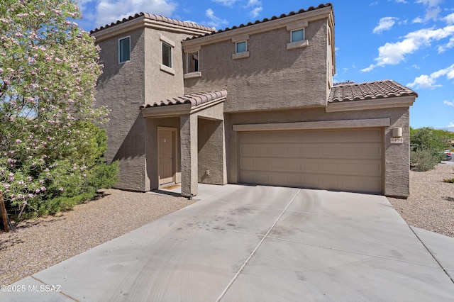 6494 E Brushback Loop, Tucson, AZ 85756 - view of front facade featuring a tiled roof, stucco siding, and driveway