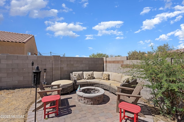 6494 E Brushback Loop, Tucson, AZ 85756 - view of patio / terrace with fence and an outdoor living space with a fire pit