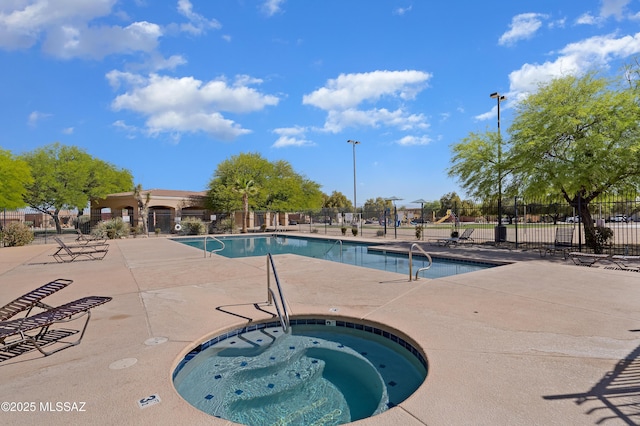 6494 E Brushback Loop, Tucson, AZ 85756 - community pool with a hot tub, fence, and a patio area