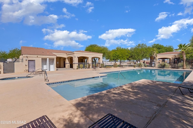 6494 E Brushback Loop, Tucson, AZ 85756 - community pool with fence, a patio, and a hot tub