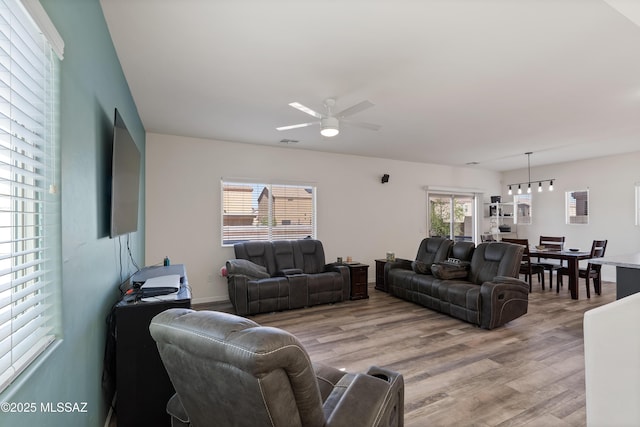 6494 E Brushback Loop, Tucson, AZ 85756 - living room featuring light wood-style flooring and a ceiling fan