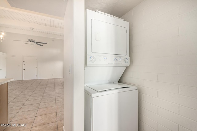 2525 N Alvernon Way Unit F8, Tucson, AZ 85712 - clothes washing area featuring stacked washer / dryer, a ceiling fan, and concrete block wall
