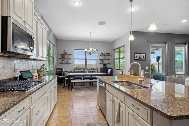 5920 W Yuma Mine Cir, Tucson, AZ 85743 - kitchen featuring appliances with stainless steel finishes, a sink, decorative backsplash, recessed lighting, and a chandelier