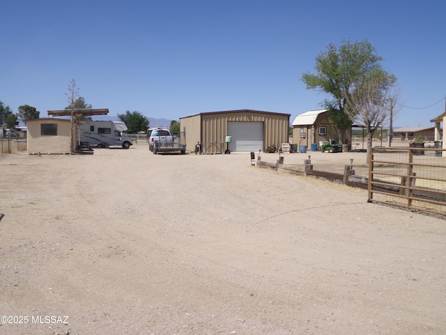 2474 W Victoria Ln, Willcox, AZ 85643 - view of yard featuring fence, an outdoor structure, a garage, and driveway