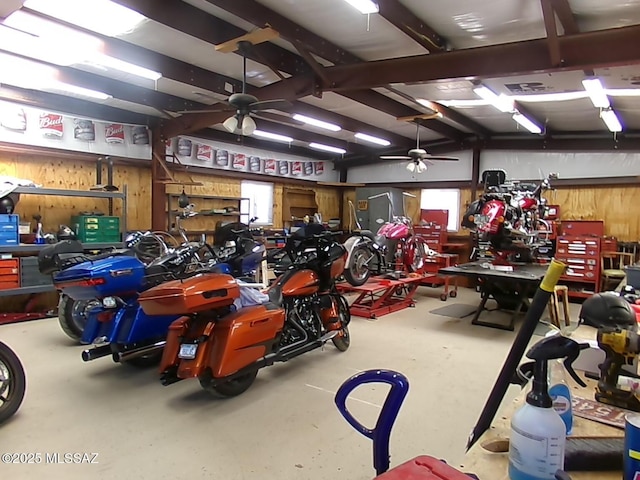 2474 W Victoria Ln, Willcox, AZ 85643 - garage with a workshop area, a ceiling fan, and wooden walls