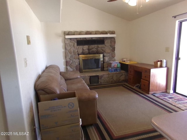 2474 W Victoria Ln, Willcox, AZ 85643 - living area with lofted ceiling, ceiling fan, and a stone fireplace