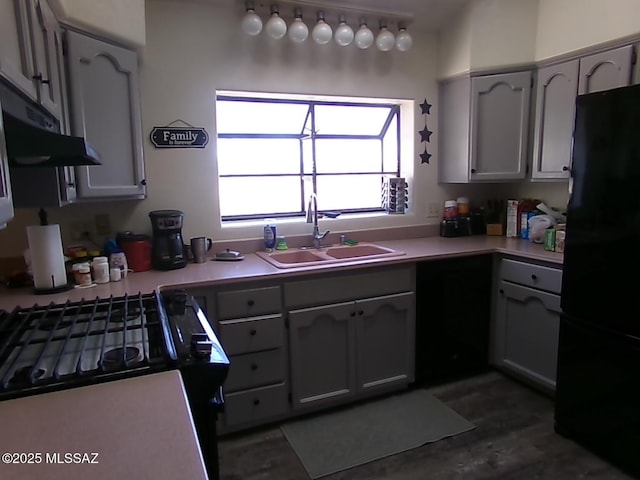 2474 W Victoria Ln, Willcox, AZ 85643 - kitchen featuring black appliances, a sink, light countertops, dark wood finished floors, and under cabinet range hood