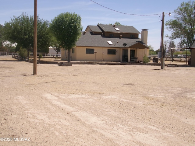 2474 W Victoria Ln, Willcox, AZ 85643 - rear view of house featuring a chimney