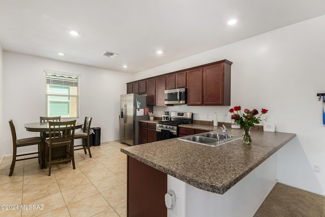 6210 S Open Desert Pl, Tucson, AZ 85706 - kitchen featuring appliances with stainless steel finishes, a sink, dark countertops, a peninsula, and recessed lighting