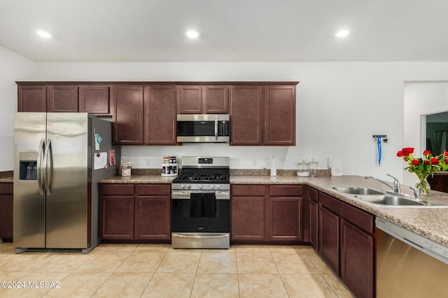 6210 S Open Desert Pl, Tucson, AZ 85706 - kitchen with appliances with stainless steel finishes, a sink, light tile patterned floors, and recessed lighting