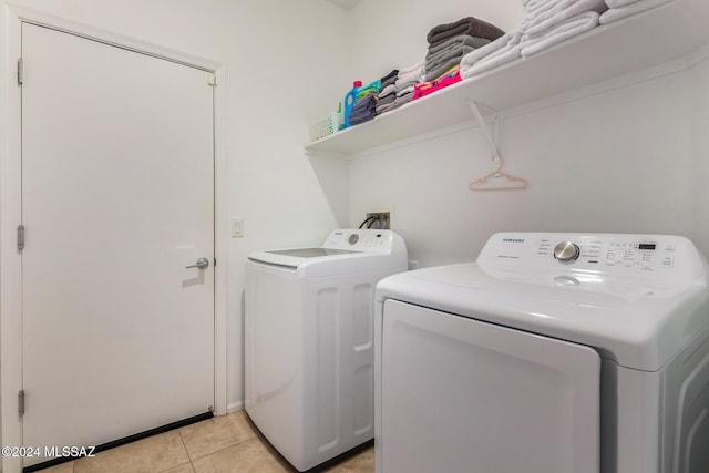 6210 S Open Desert Pl, Tucson, AZ 85706 - washroom with washing machine and clothes dryer and light tile patterned flooring