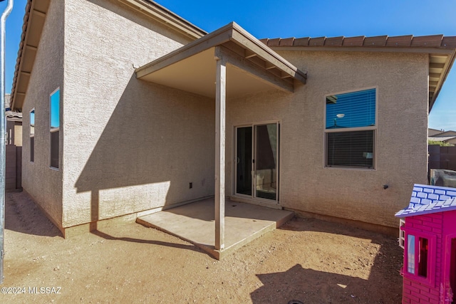 6210 S Open Desert Pl, Tucson, AZ 85706 - back of house with stucco siding and a patio area