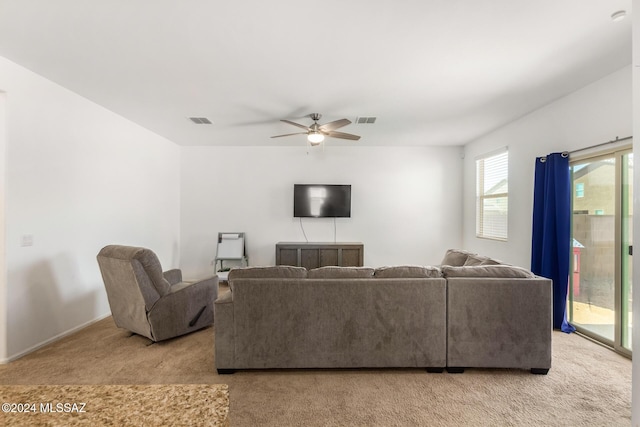 6210 S Open Desert Pl, Tucson, AZ 85706 - living room with light carpet, ceiling fan, and baseboards